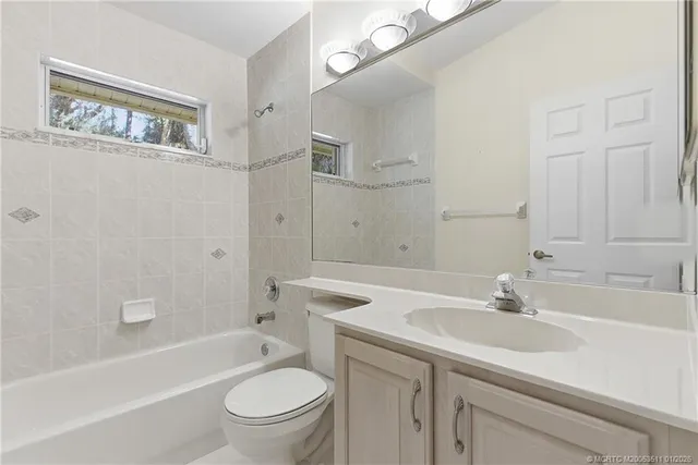 a bathroom with a sink a toilet and a bathtub