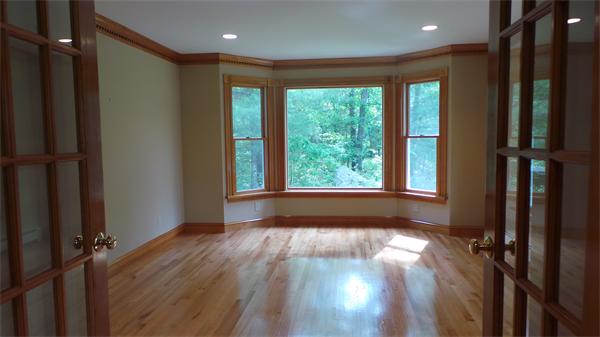 19 Carter Road Foxboro, MA 02035 - Photo 7 of 30 a view of hallway with a large window and wooden floor