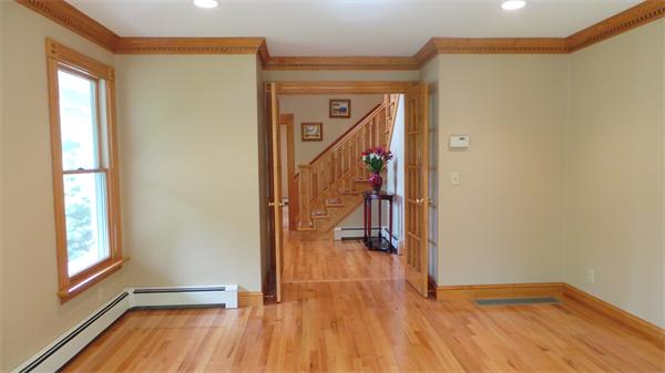 19 Carter Road Foxboro, MA 02035 - Photo 8 of 30 a view of empty room with wooden floor and fan