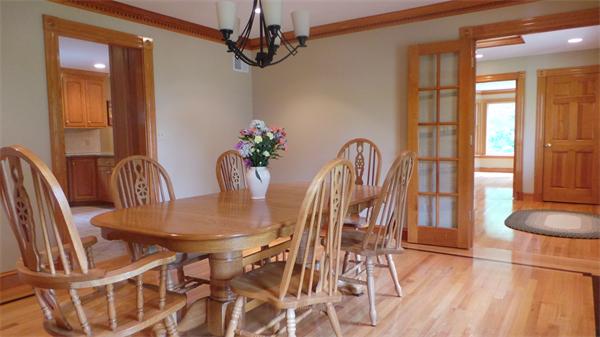 19 Carter Road Foxboro, MA 02035 - Photo 10 of 30 a view of a dining room with furniture and chandelier
