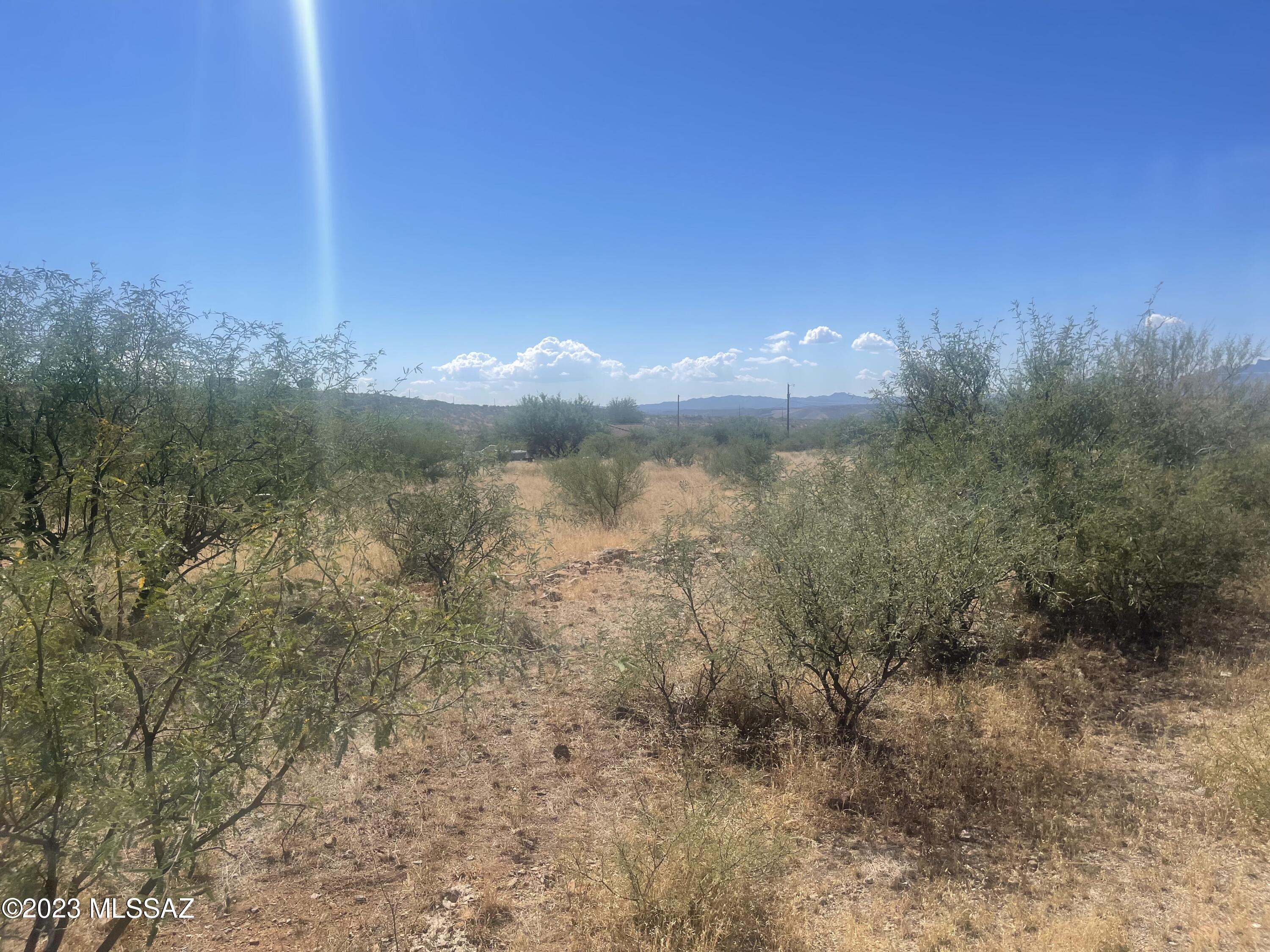 1780 Zimmer Court, Unit LOT 23 Rio Rico, AZ 85648 - Photo 2 of 3 a view of a lake with a mountain