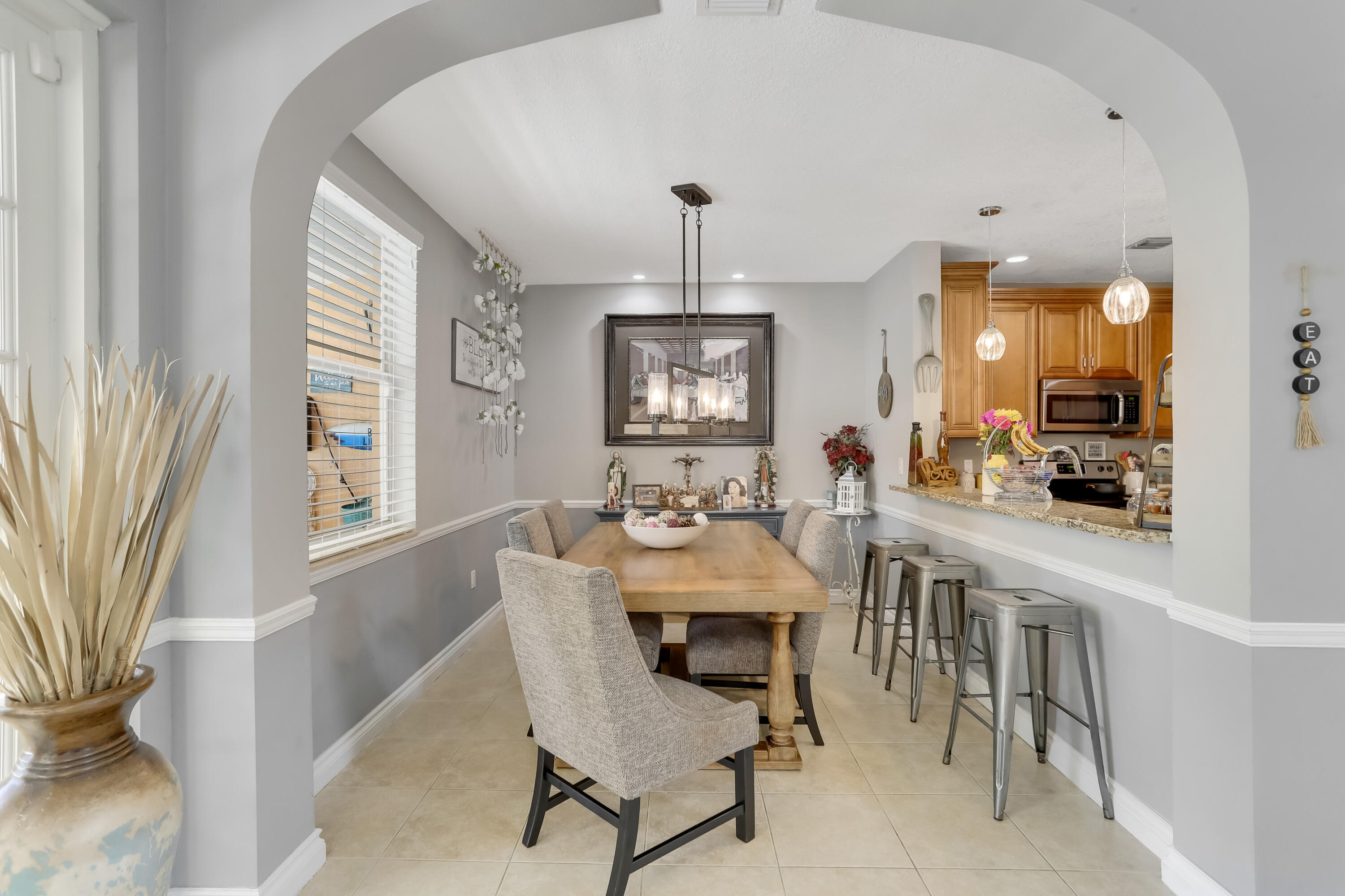 7855 Oak Grove Circle Lake Worth, FL 33467 - Photo 14 of 40 a view of a dining room with furniture and window