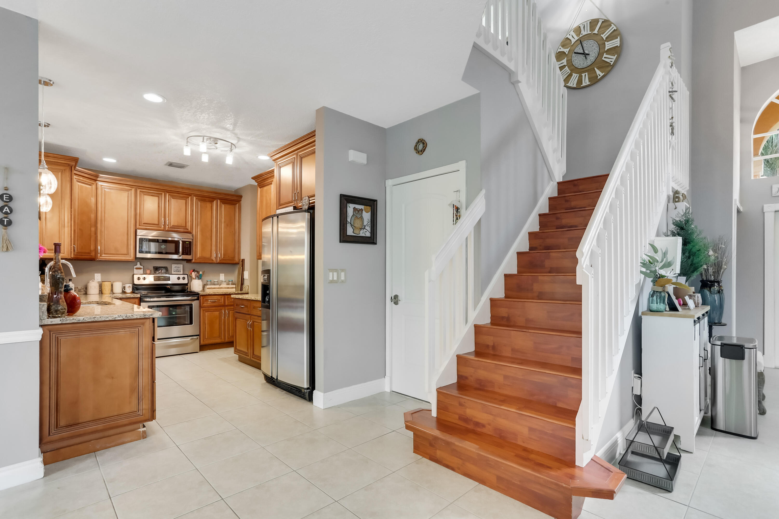 7855 Oak Grove Circle Lake Worth, FL 33467 - Photo 16 of 40 a view of kitchen with furniture and refrigerator