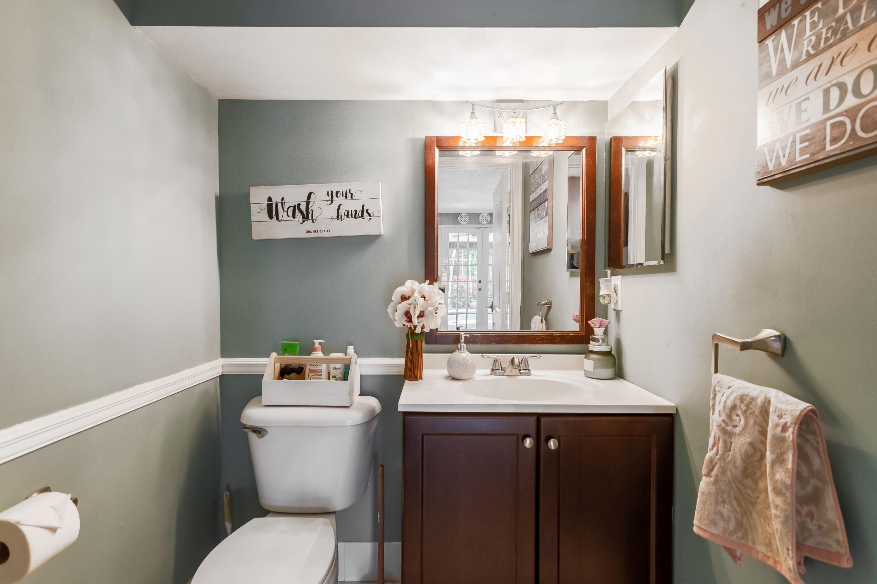 7855 Oak Grove Circle Lake Worth, FL 33467 - Photo 22 of 40 a bathroom with a sink vanity mirror and toilet