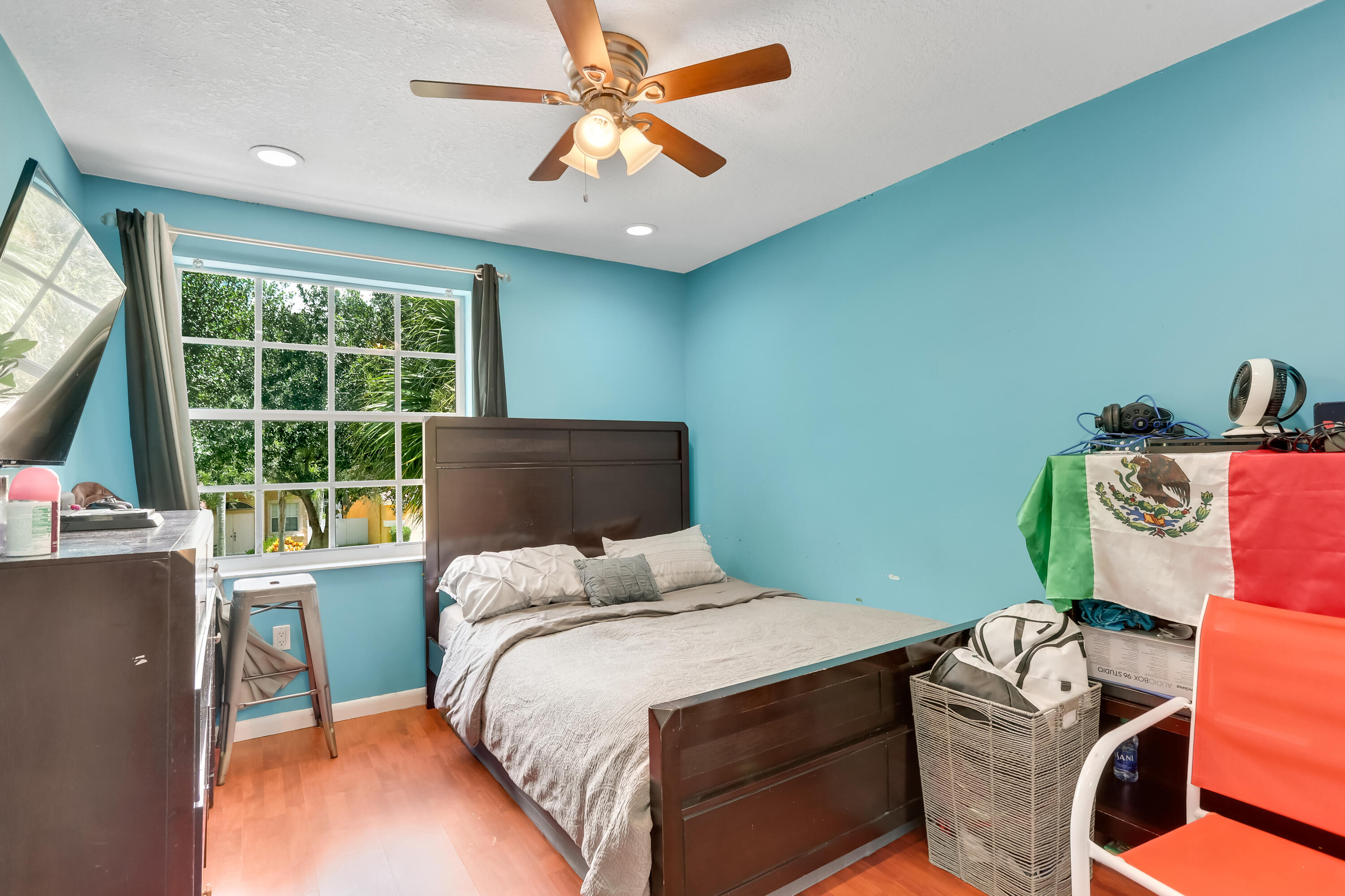 7855 Oak Grove Circle Lake Worth, FL 33467 - Photo 23 of 40 a bedroom with a bed and a window