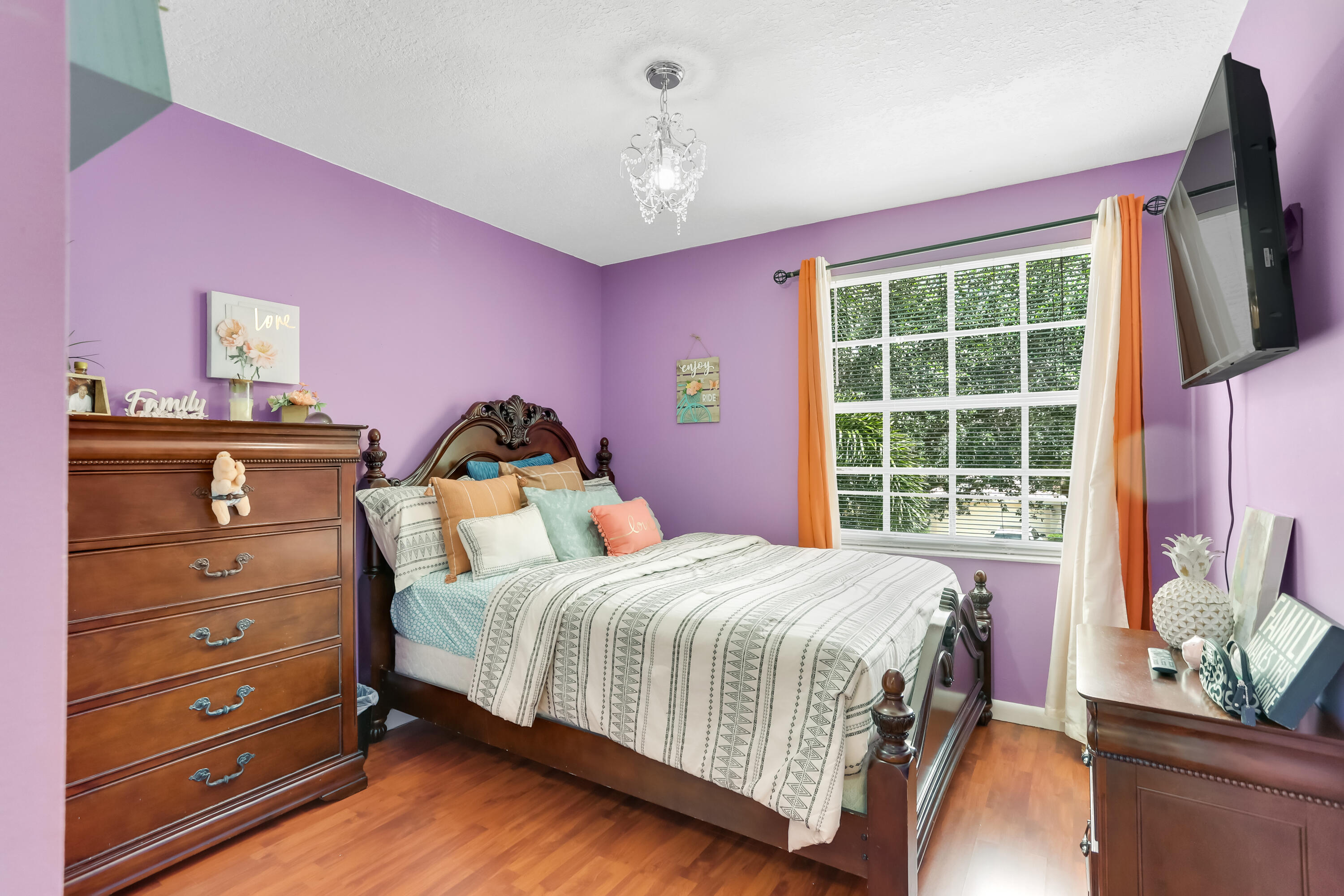 7855 Oak Grove Circle Lake Worth, FL 33467 - Photo 25 of 40 a bedroom with a bed and a window