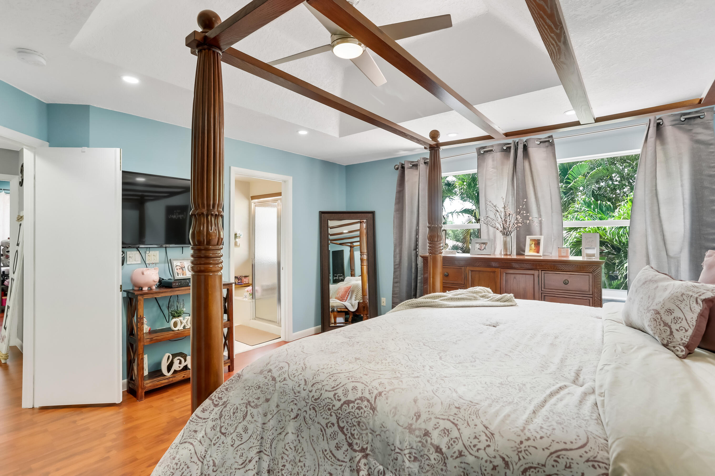 7855 Oak Grove Circle Lake Worth, FL 33467 - Photo 29 of 40 a bedroom with a large bed and a large window