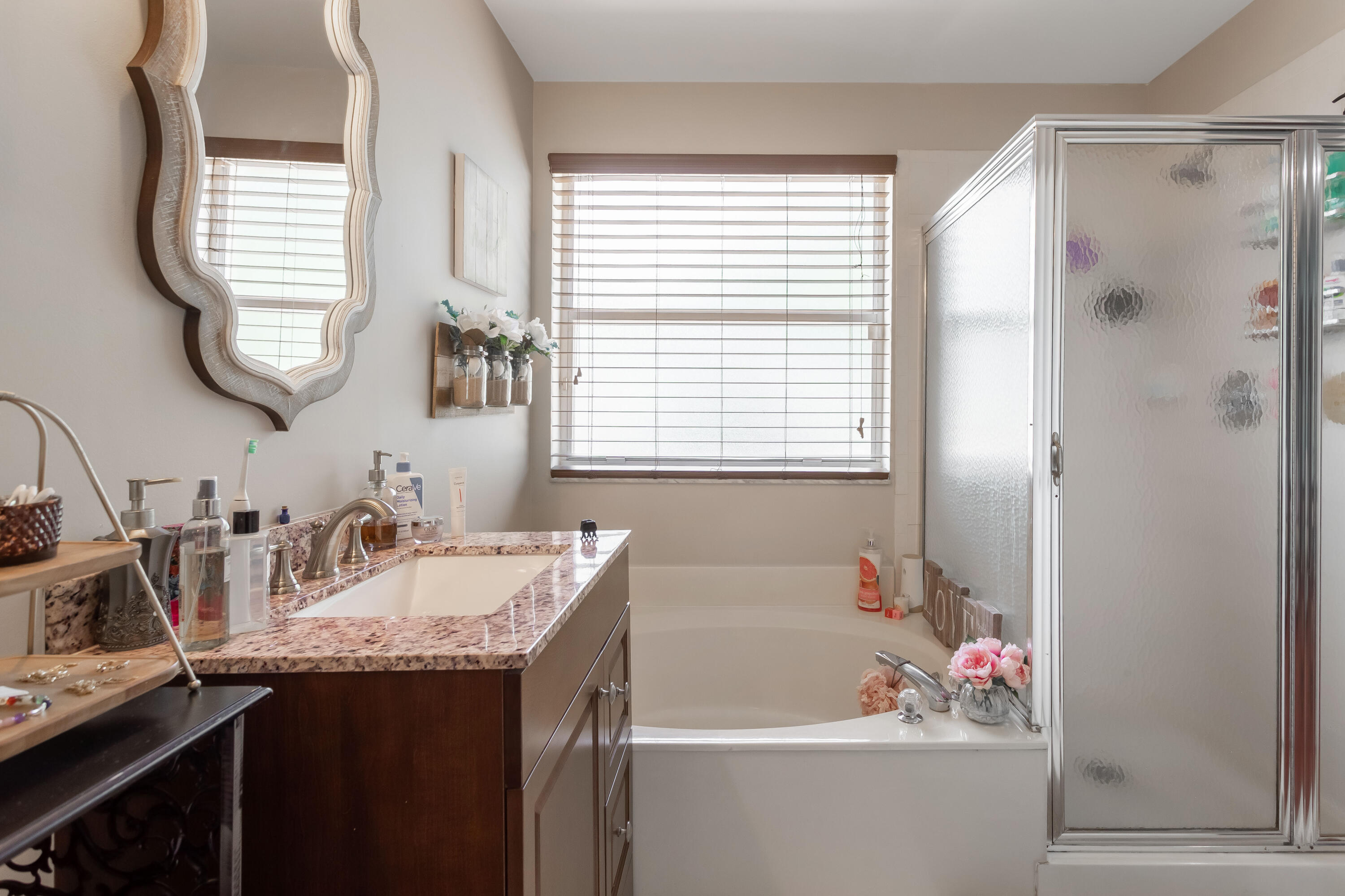 7855 Oak Grove Circle Lake Worth, FL 33467 - Photo 30 of 40 a bathroom with a granite countertop sink and a bathtub