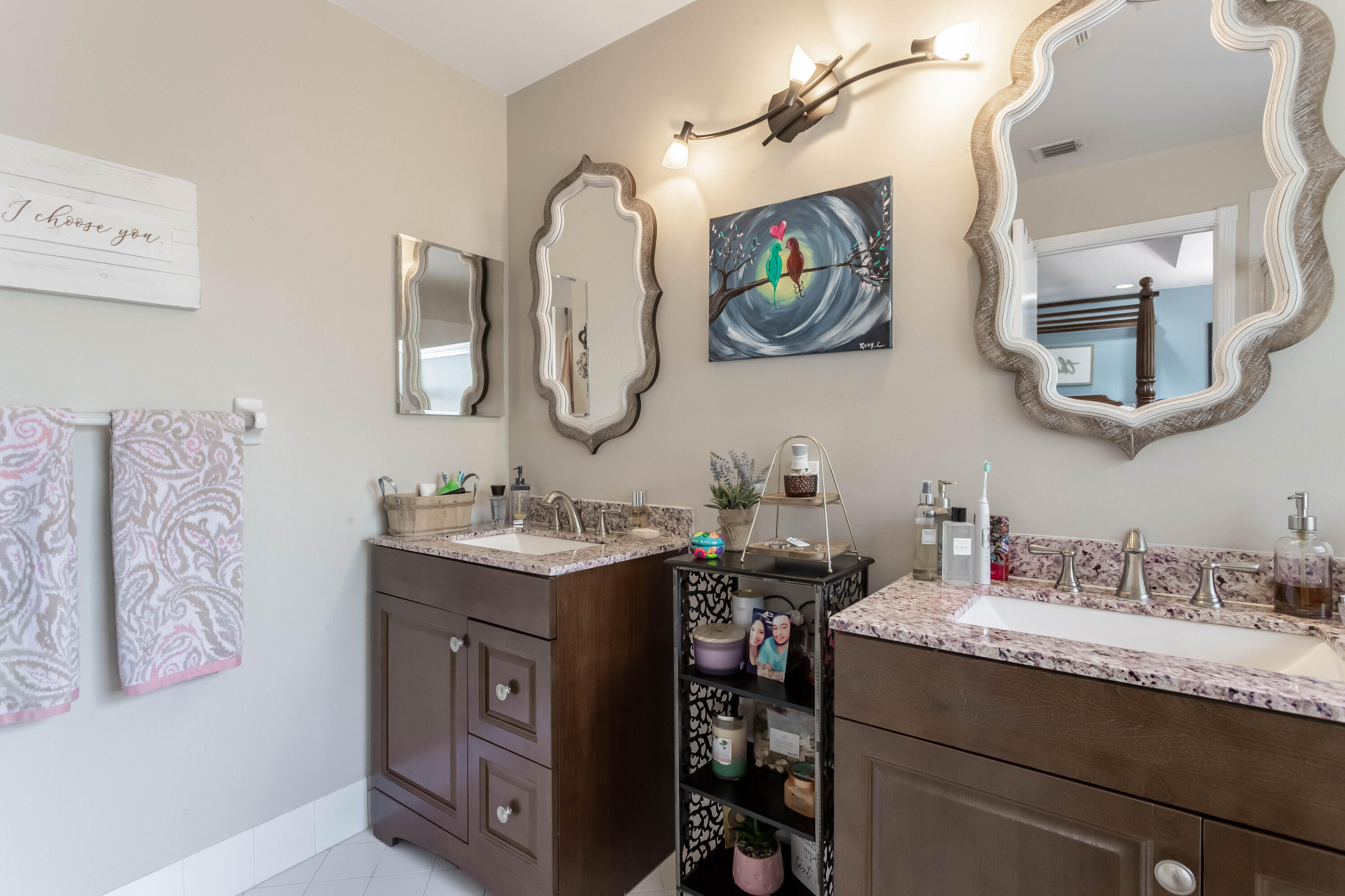 7855 Oak Grove Circle Lake Worth, FL 33467 - Photo 31 of 40 a bathroom with a granite countertop sink a mirror and a