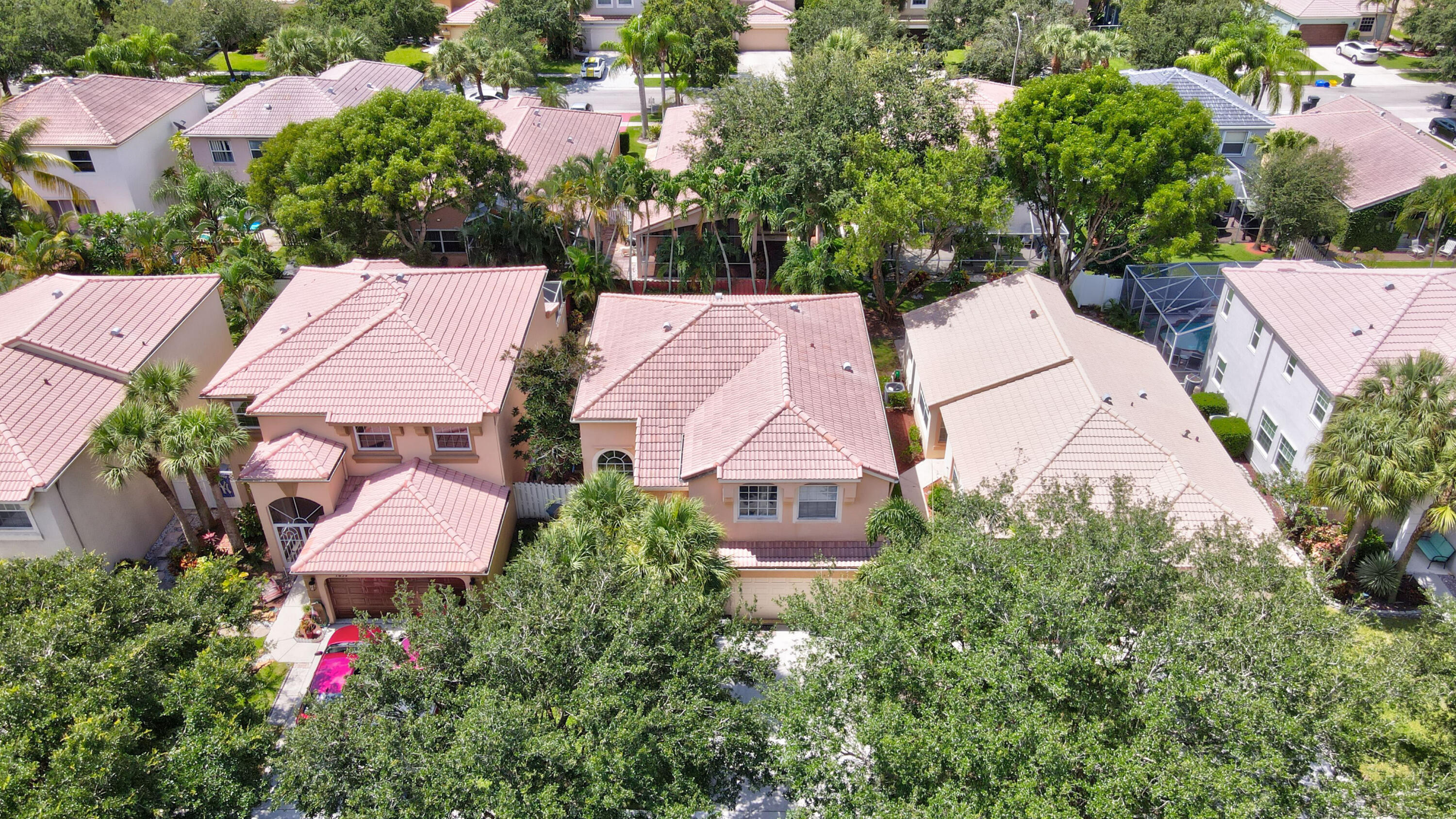 7855 Oak Grove Circle Lake Worth, FL 33467 - Photo 33 of 40 an aerial view of house with yard and mountain view in back