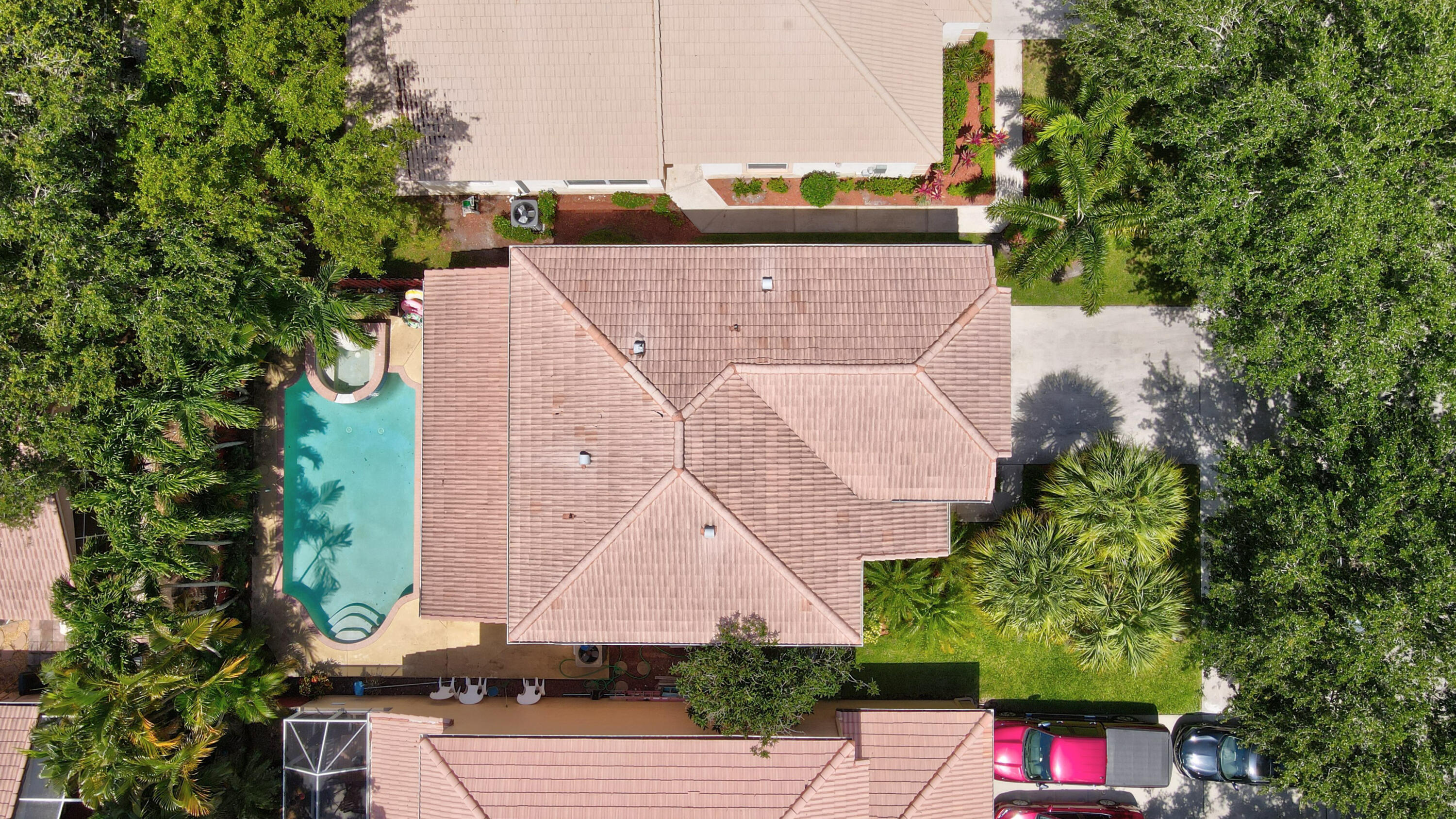 7855 Oak Grove Circle Lake Worth, FL 33467 - Photo 34 of 40 an aerial view of a house with a yard and a large tree