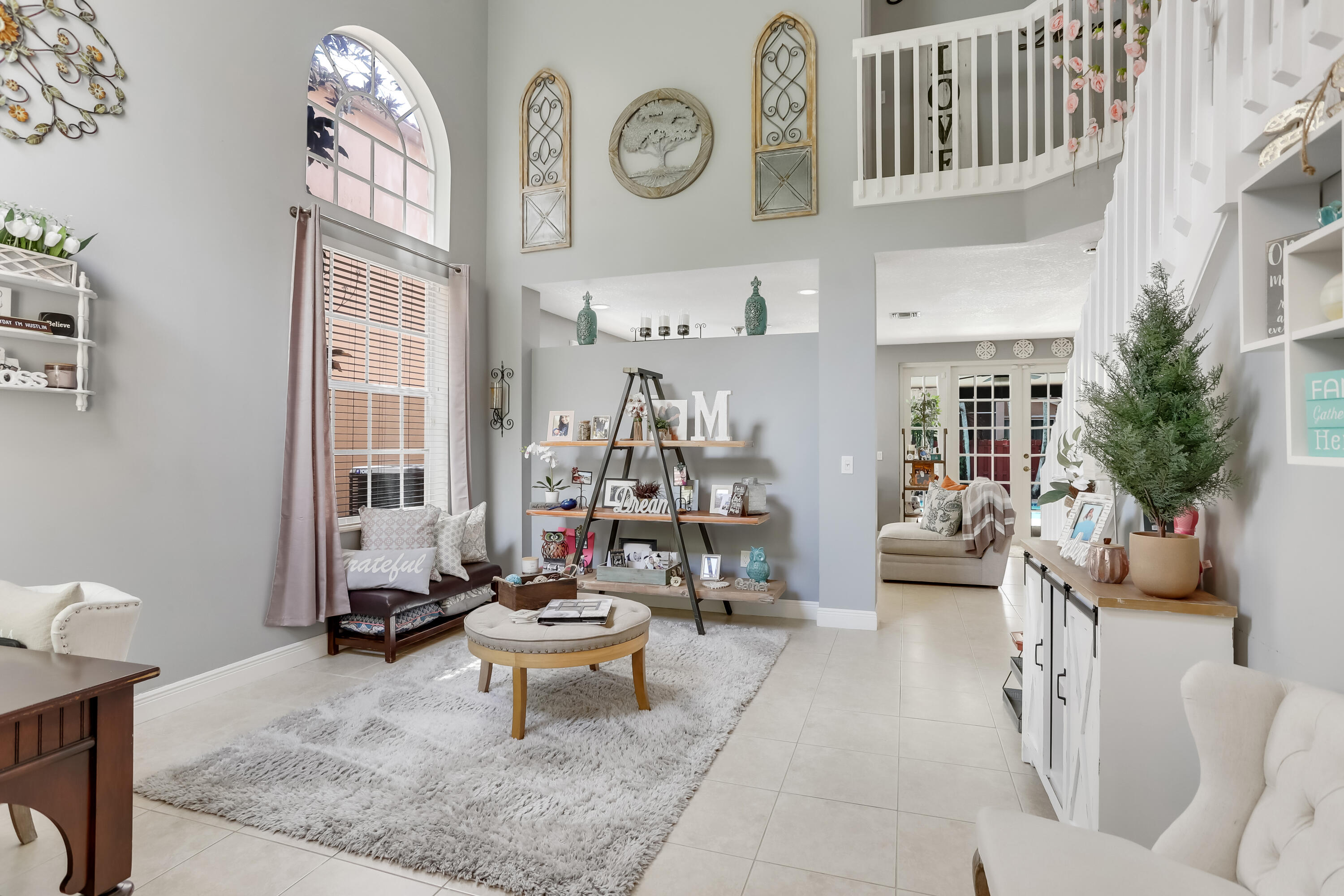 7855 Oak Grove Circle Lake Worth, FL 33467 - Photo 5 of 40 a living room with fireplace furniture and a large window