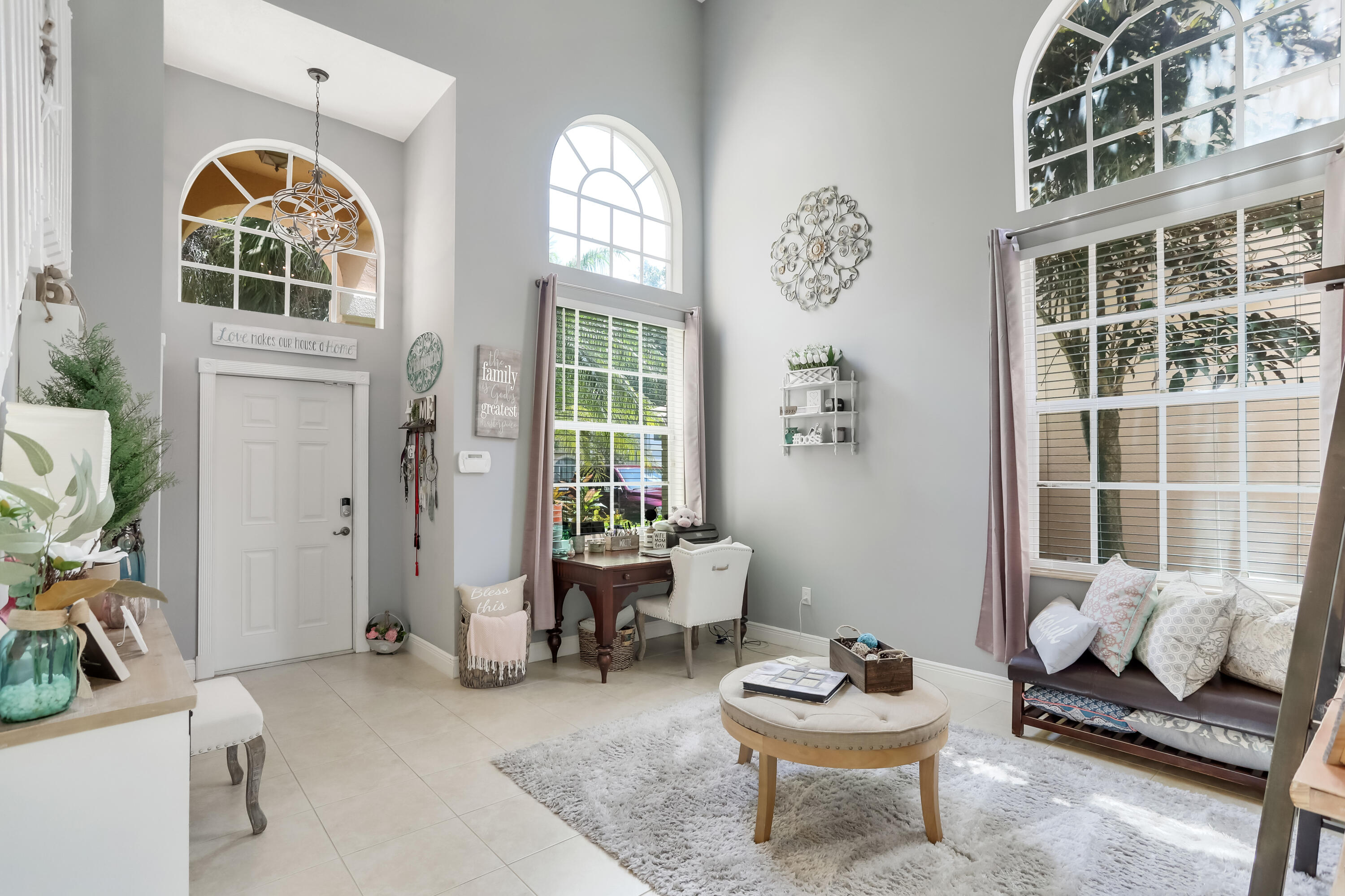 7855 Oak Grove Circle Lake Worth, FL 33467 - Photo 6 of 40 a living room with furniture and a large window