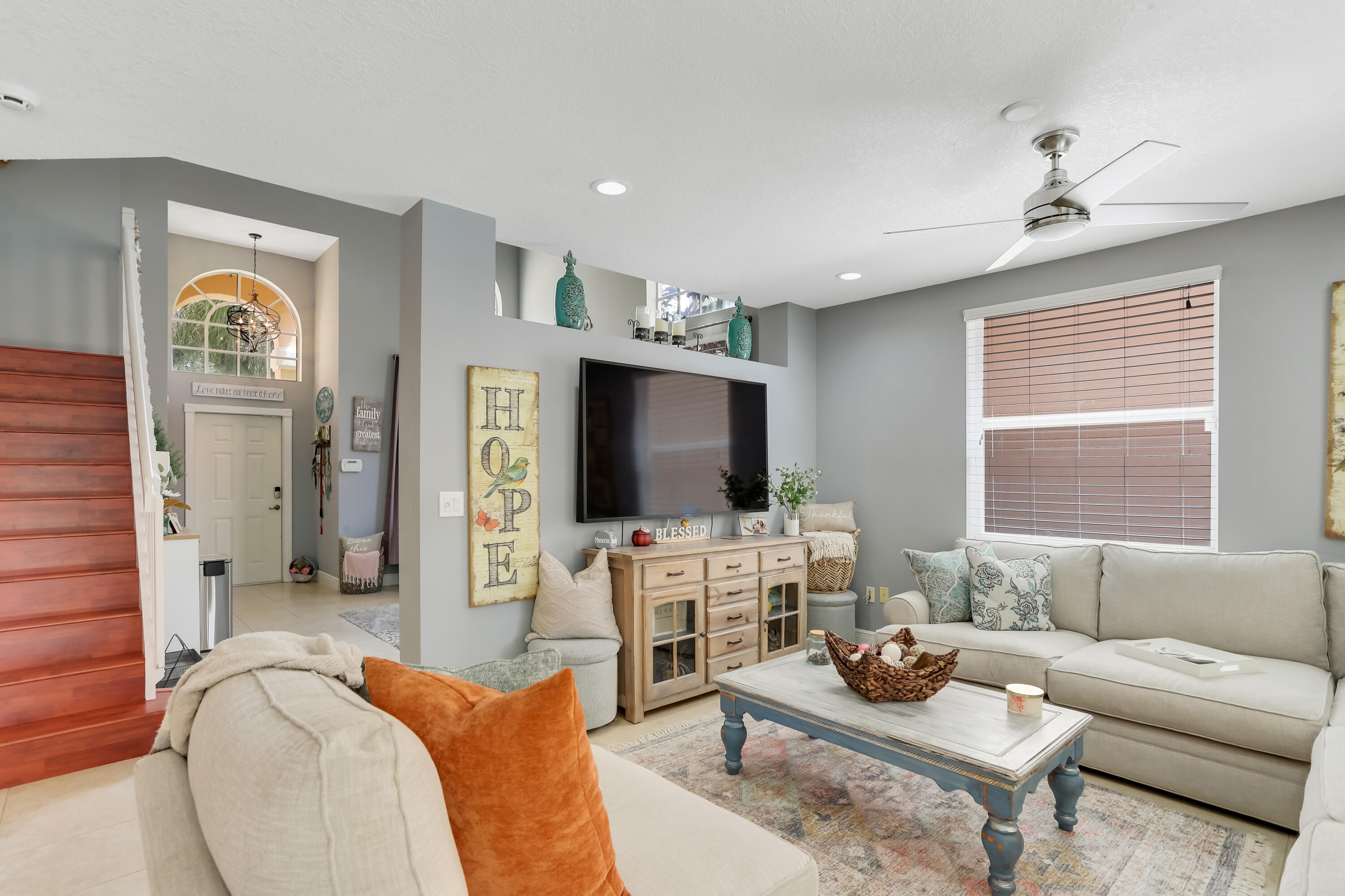 7855 Oak Grove Circle Lake Worth, FL 33467 - Photo 7 of 40 a living room with furniture and a flat screen tv