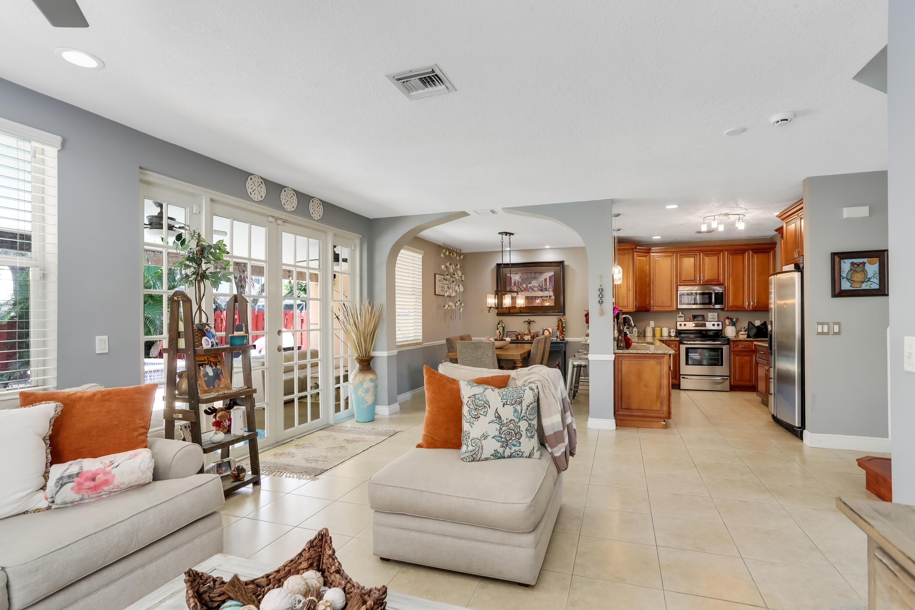 7855 Oak Grove Circle Lake Worth, FL 33467 - Photo 8 of 40 a living room with furniture and a view of kitchen