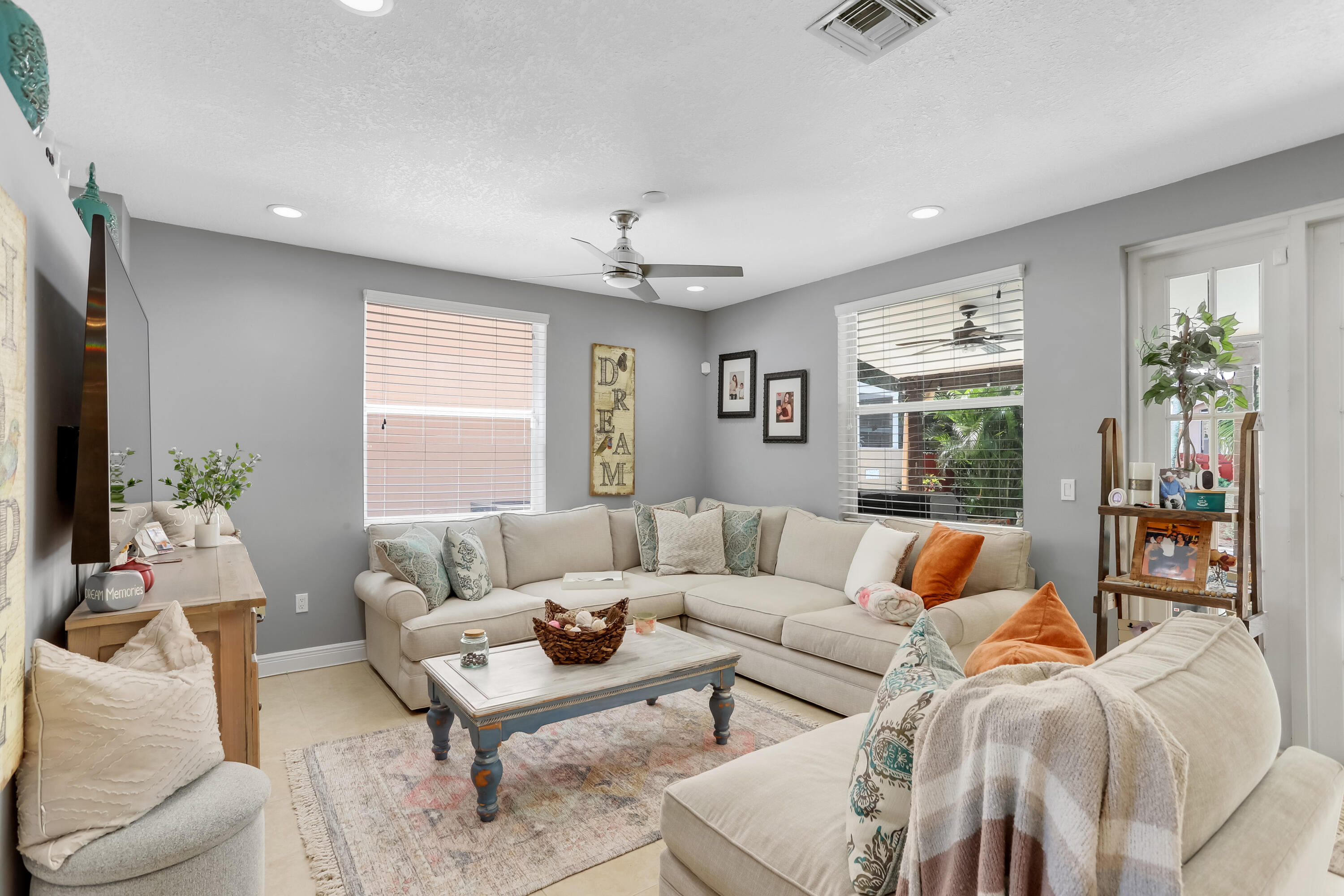 7855 Oak Grove Circle Lake Worth, FL 33467 - Photo 9 of 40 a living room with furniture and a large window