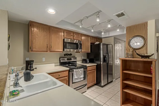 a kitchen with a sink stove and microwave