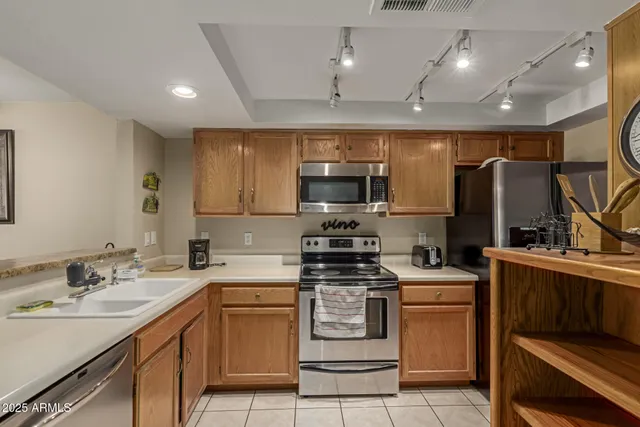 a kitchen with a sink stove and microwave