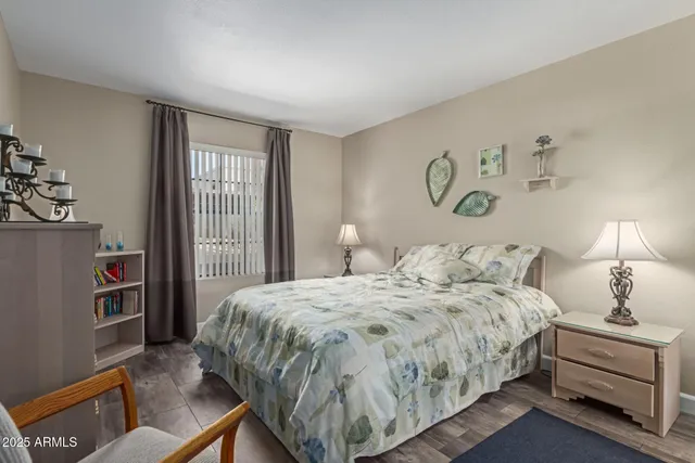 a bedroom with a bed and a dresser