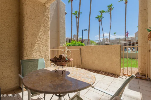 a view of a dining room with furniture and a potted plant