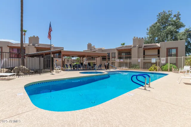 a view of a swimming pool with a lake view