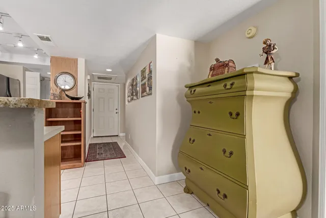 a living room with furniture a flat screen tv and a large window