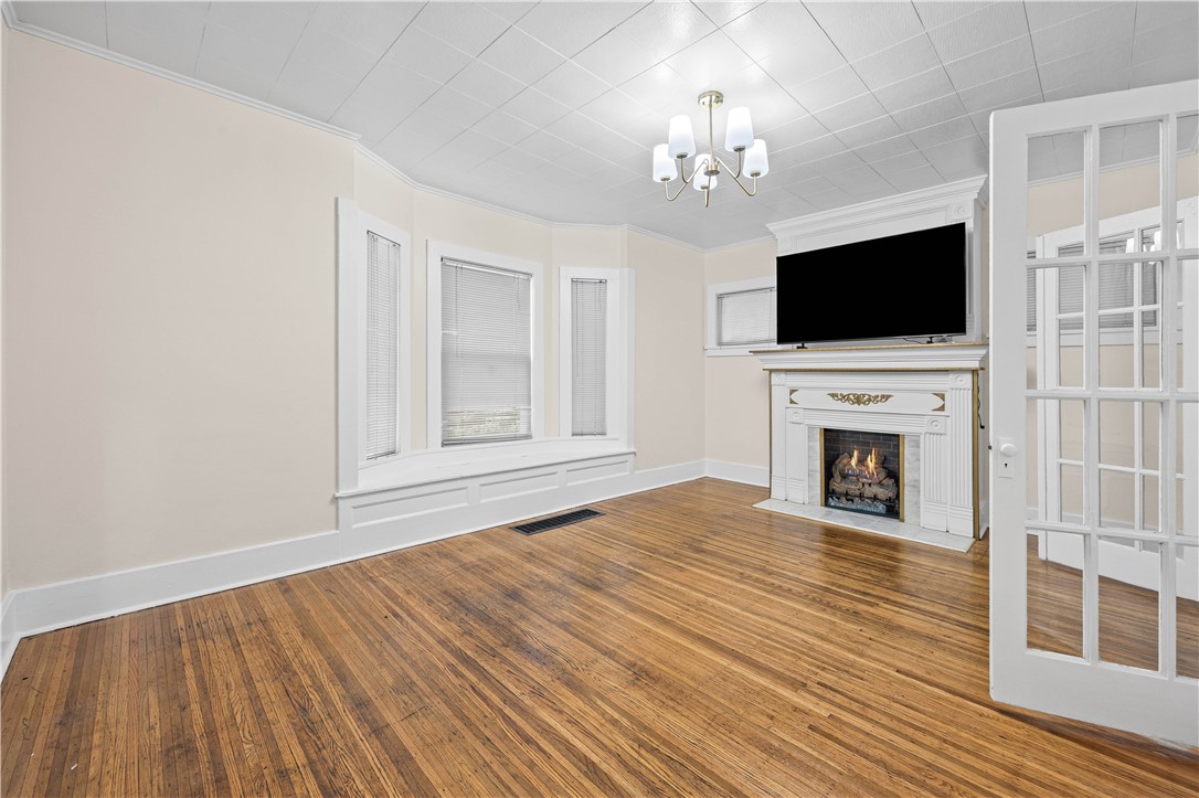827 Garson Avenue Rochester, NY 14609 - Photo 4 of 40 Unit #1 | Living Room: Refinished hardwood floors,