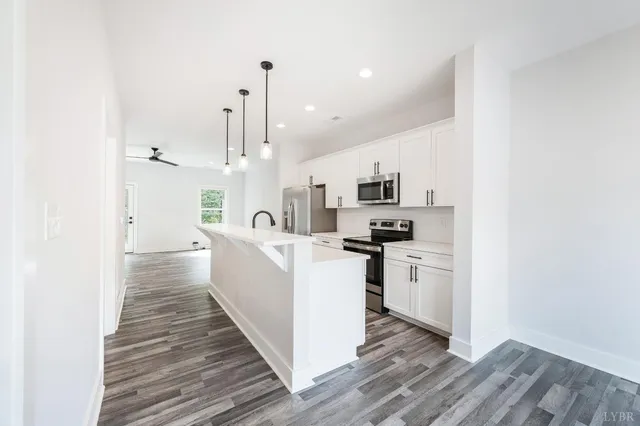 a kitchen with a stove and a microwave