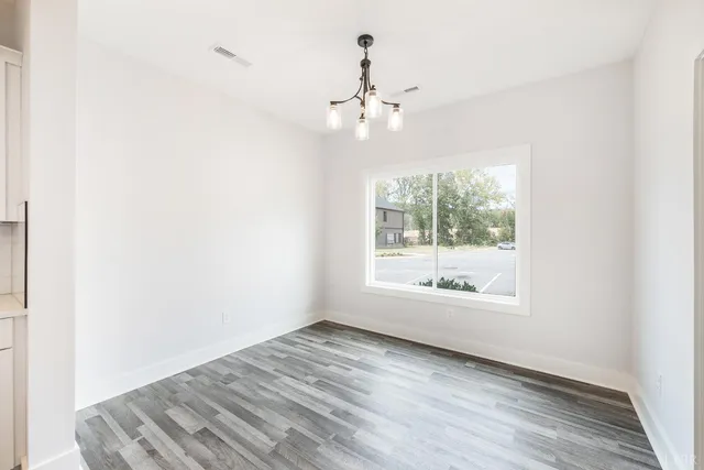 a view of small space with wooden floor
