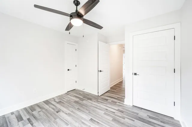 a view of a room with wooden floor