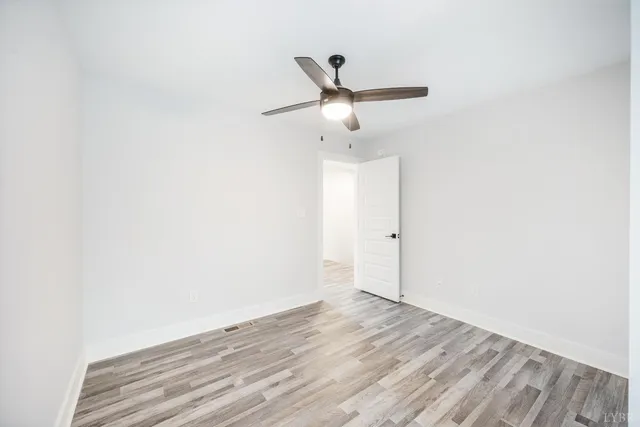 a view of a park with large trees