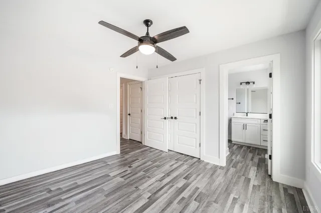 a view of backyard of house and garage