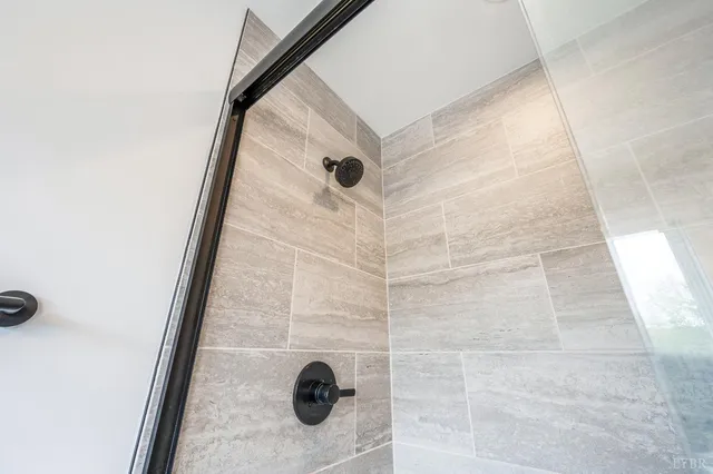 a aerial view of a brick house next to a yard