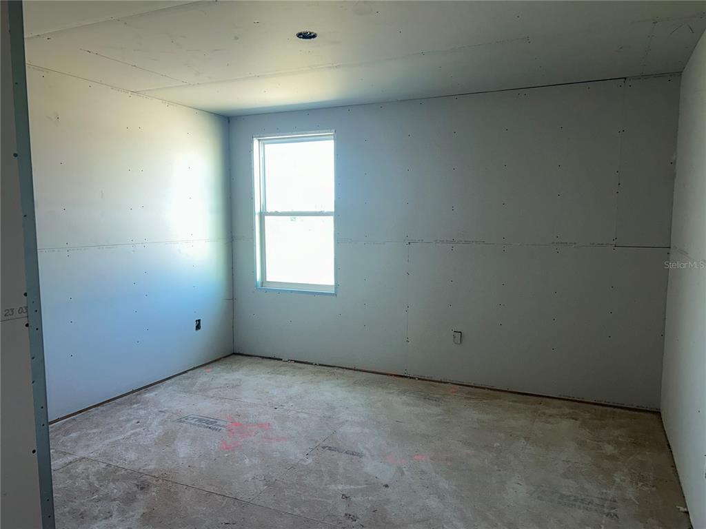 10123 Hidden Hammock Loop Parrish, FL 34221 - Photo 14 of 32 an empty room with a window