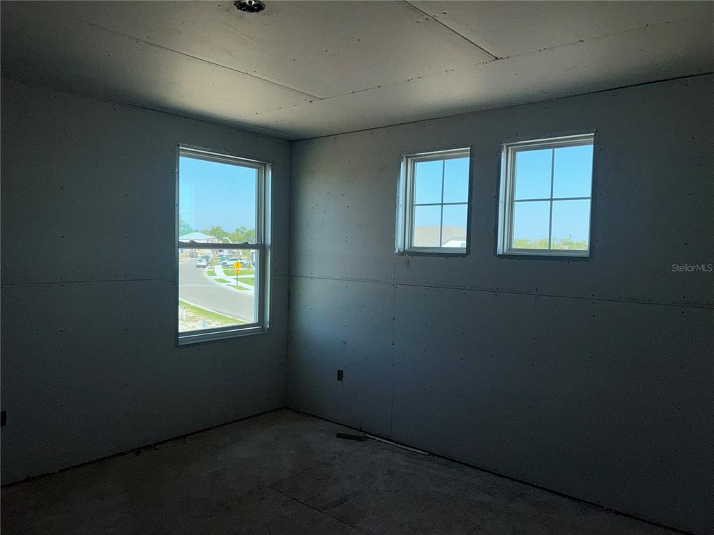 10123 Hidden Hammock Loop Parrish, FL 34221 - Photo 16 of 32 an empty room with windows