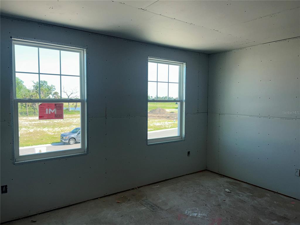 10123 Hidden Hammock Loop Parrish, FL 34221 - Photo 19 of 32 an empty room with a window