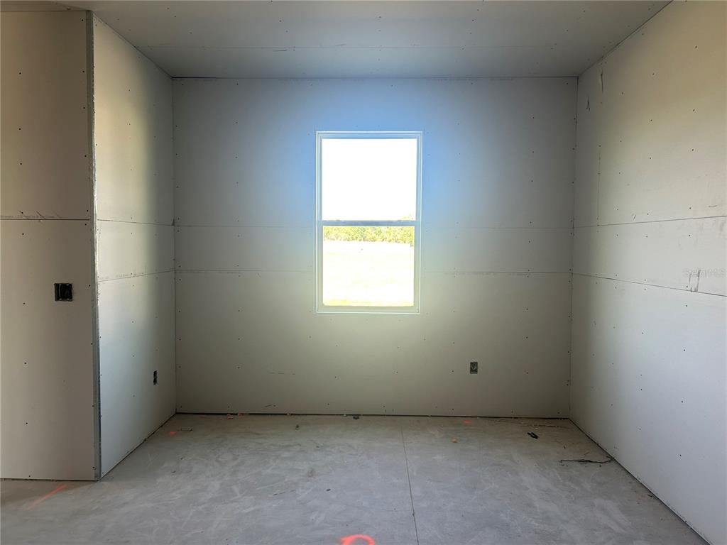 10123 Hidden Hammock Loop Parrish, FL 34221 - Photo 20 of 32 an empty room with a window
