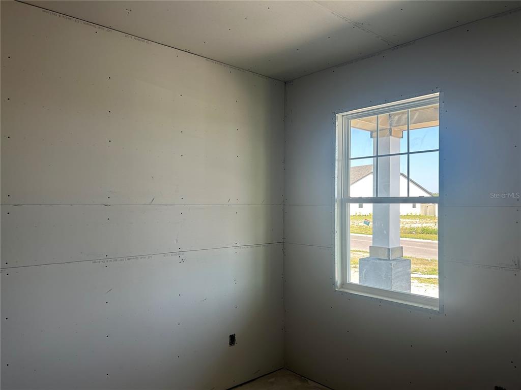 10123 Hidden Hammock Loop Parrish, FL 34221 - Photo 21 of 32 an empty room with a window