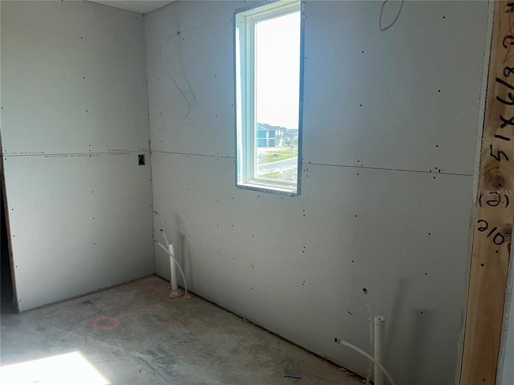 10123 Hidden Hammock Loop Parrish, FL 34221 - Photo 27 of 32 an empty room with a window
