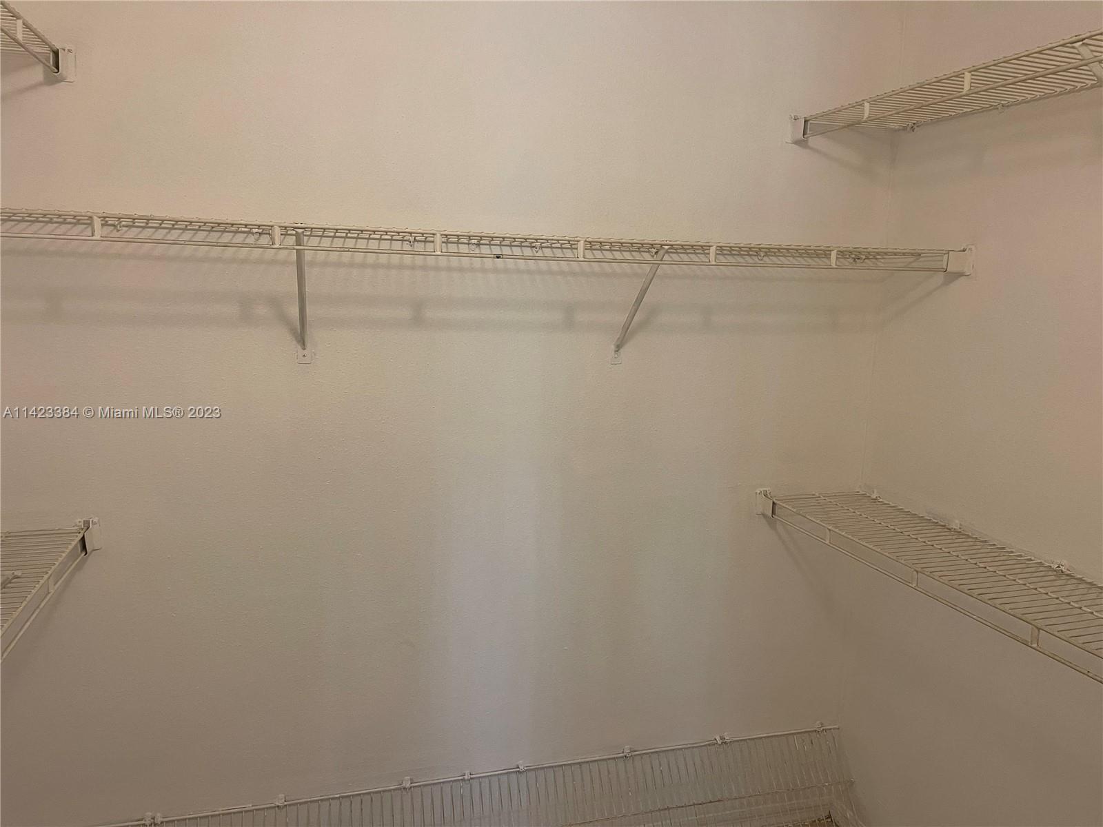 4045 West McNab Road, Unit G106 Pompano Beach, FL 33069 - Photo 13 of 23 a view of small space with racks on the wall