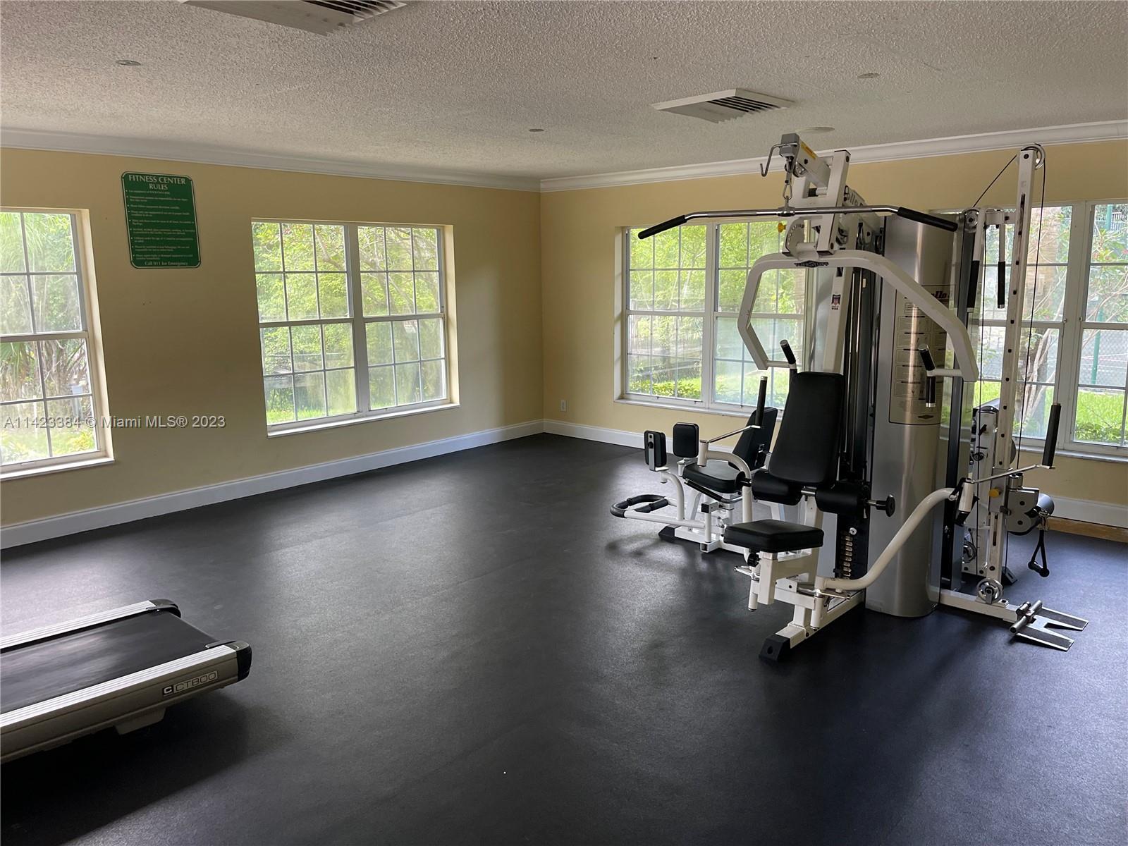 4045 West McNab Road, Unit G106 Pompano Beach, FL 33069 - Photo 22 of 23 a view of a room with gym equipment