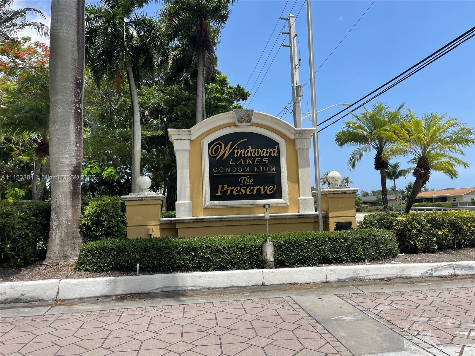 4045 West McNab Road, Unit G106 Pompano Beach, FL 33069 - Photo 23 of 23 a front view of a house with a garden