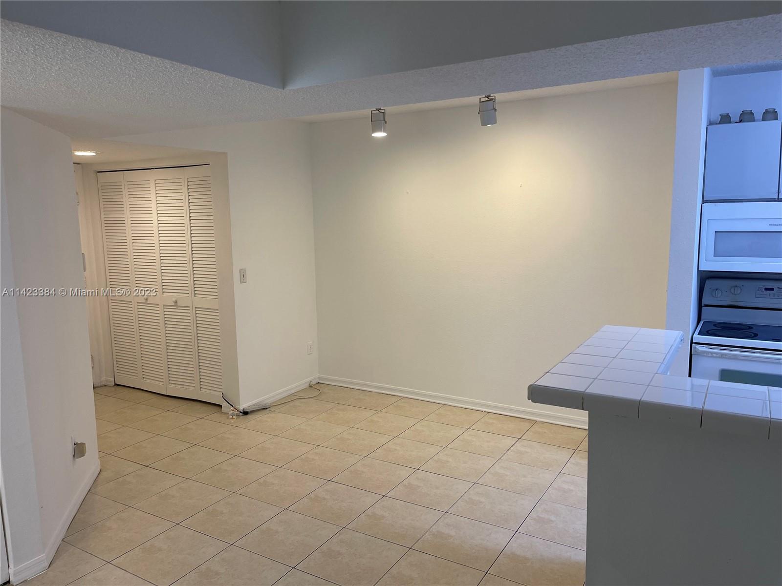 4045 West McNab Road, Unit G106 Pompano Beach, FL 33069 - Photo 3 of 23 a view of an empty room