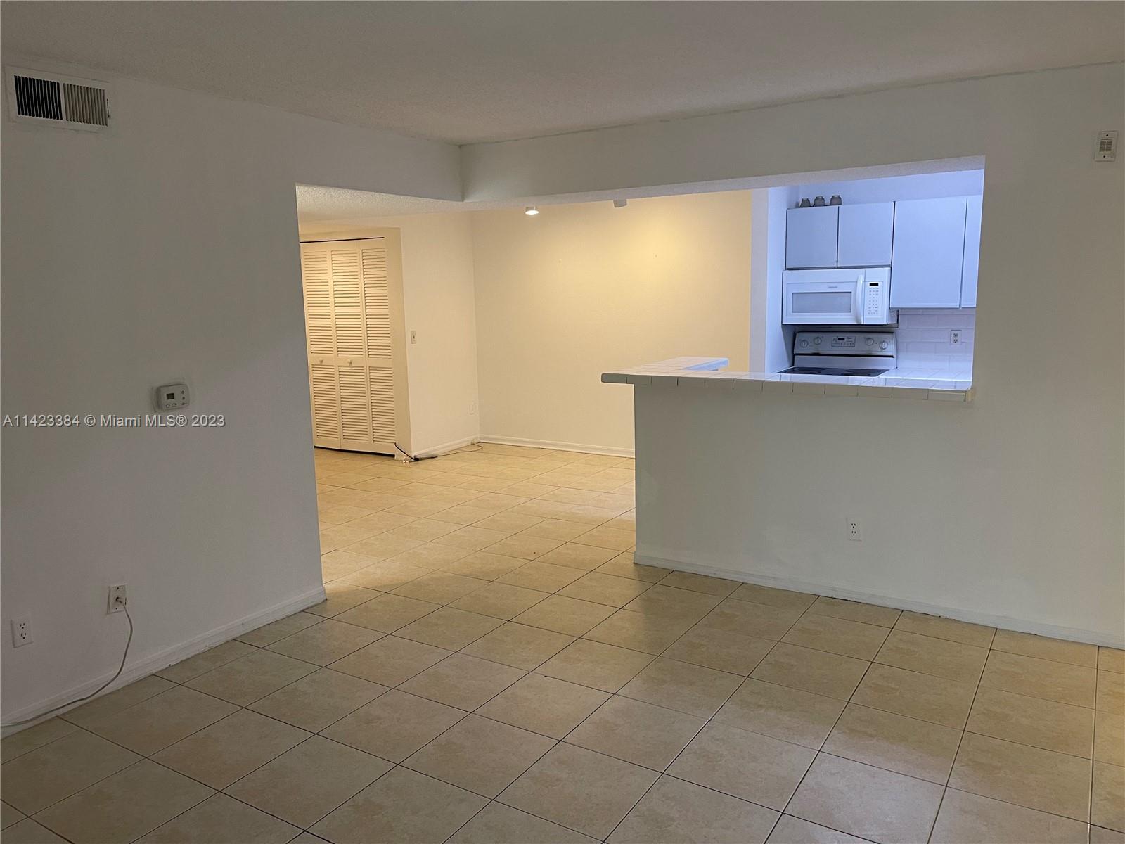 4045 West McNab Road, Unit G106 Pompano Beach, FL 33069 - Photo 4 of 23 a view of an empty room