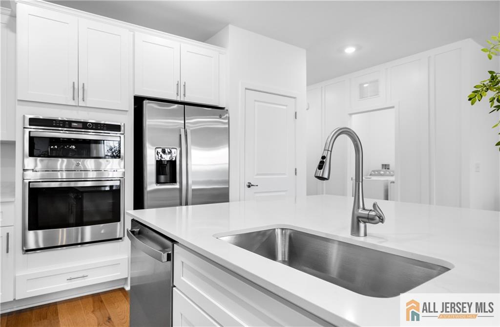 4 Prado Road Monroe Township, NJ 08831 - Photo 11 of 21 a kitchen with a refrigerator sink and stove