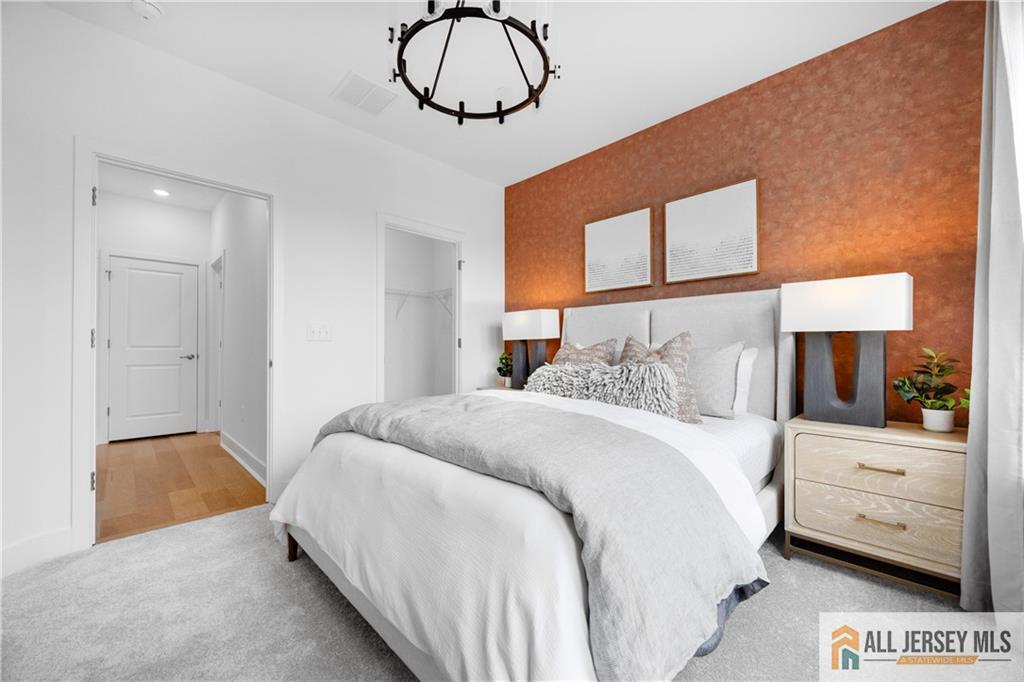 4 Prado Road Monroe Township, NJ 08831 - Photo 18 of 21 a bedroom with a bed and dresser with mirror