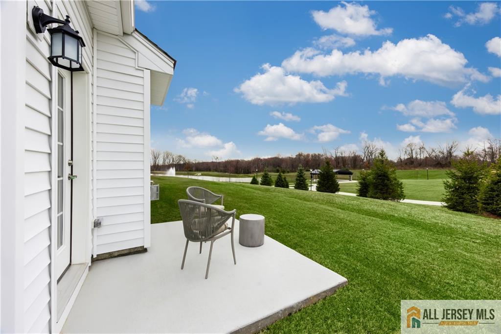 4 Prado Road Monroe Township, NJ 08831 - Photo 20 of 21 a view of a chairs and table in backyard of the house