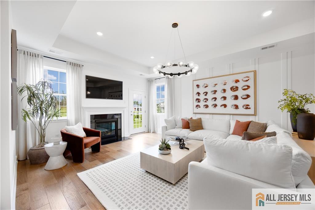 4 Prado Road Monroe Township, NJ 08831 - Photo 7 of 21 a living room with furniture fireplace and a flat screen tv