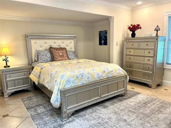 a bedroom with a bed and a dresser
