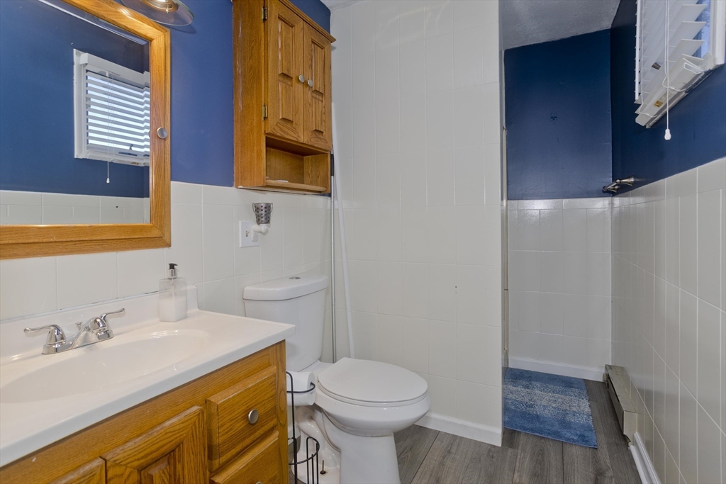 3 Fontaine Street Ludlow, MA 01056 - Photo 20 of 41 a bathroom with a sink a toilet and a mirror